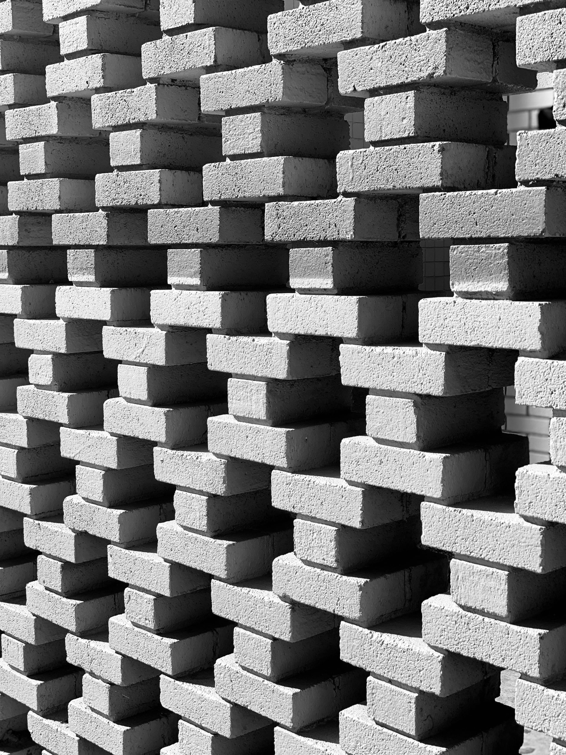 black and white photograph of a stack of bricks